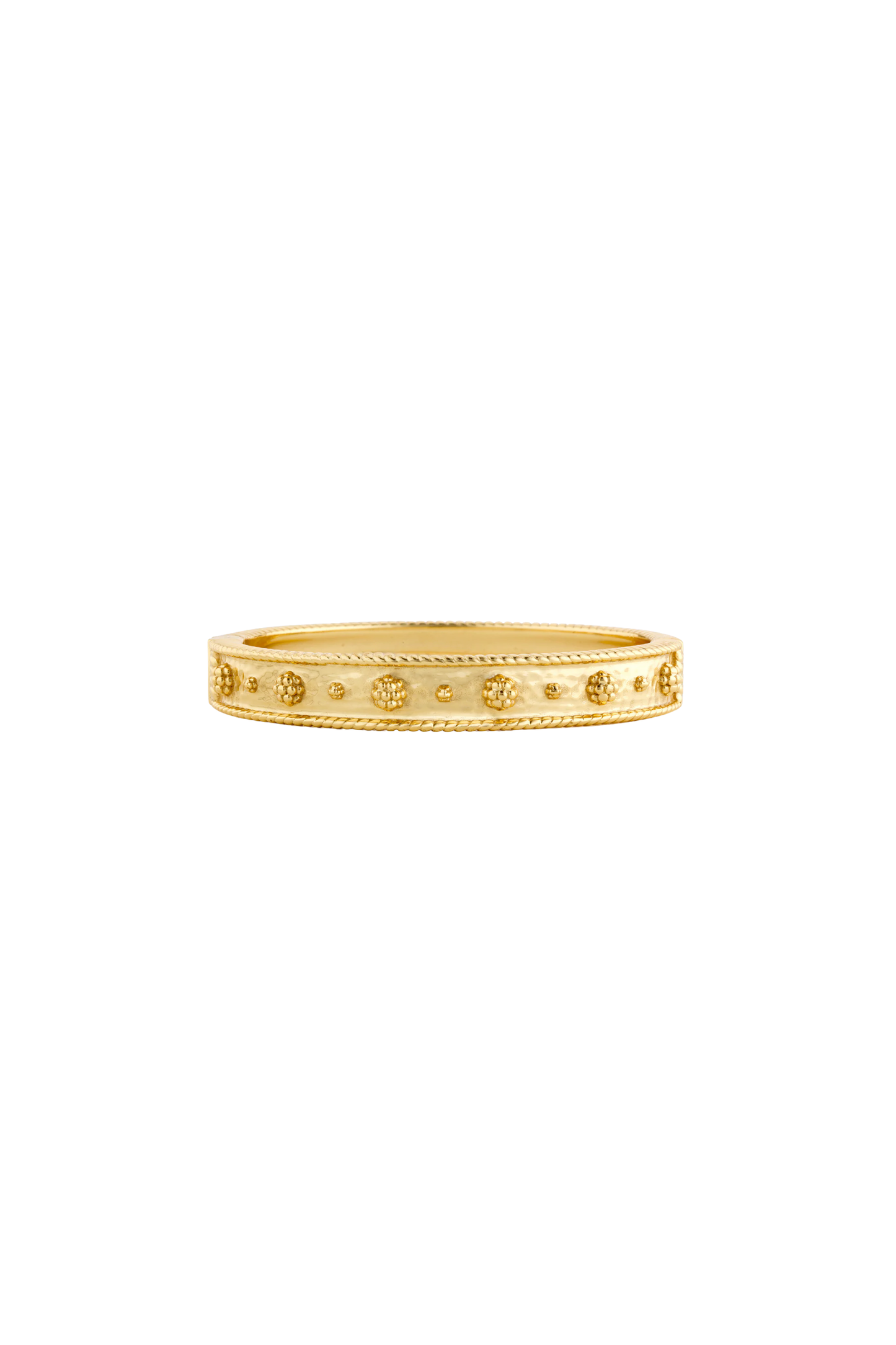 Gold ring with intricate design on a white background