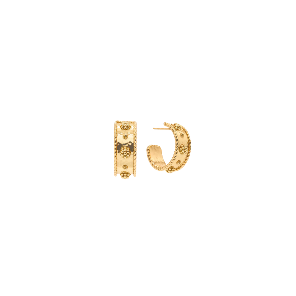 Gold hoop earrings on a white background