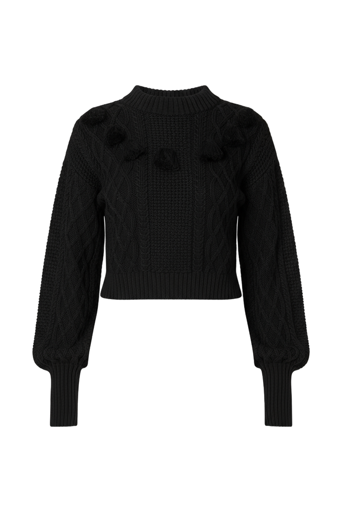 Black knit sweater with ruffled shoulders and knittdd details
