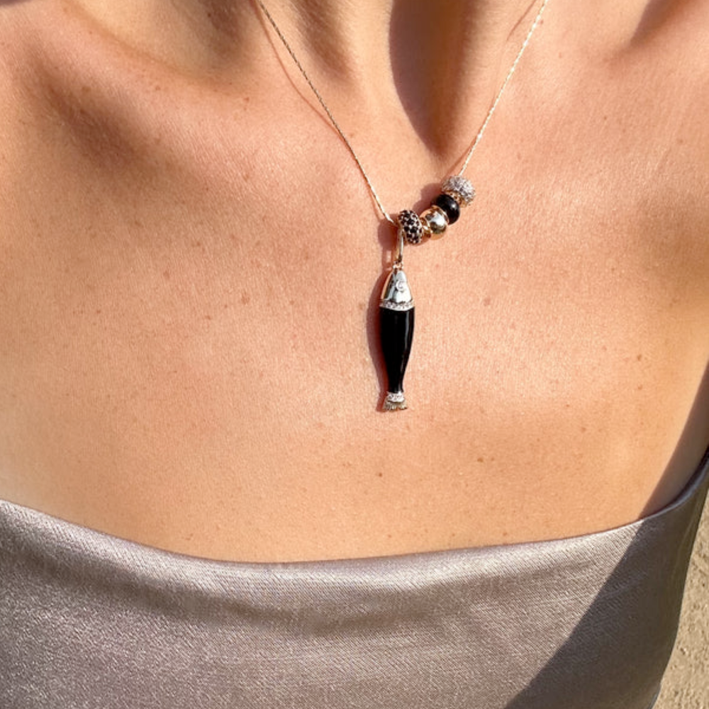 Black enamel fish shaped charm