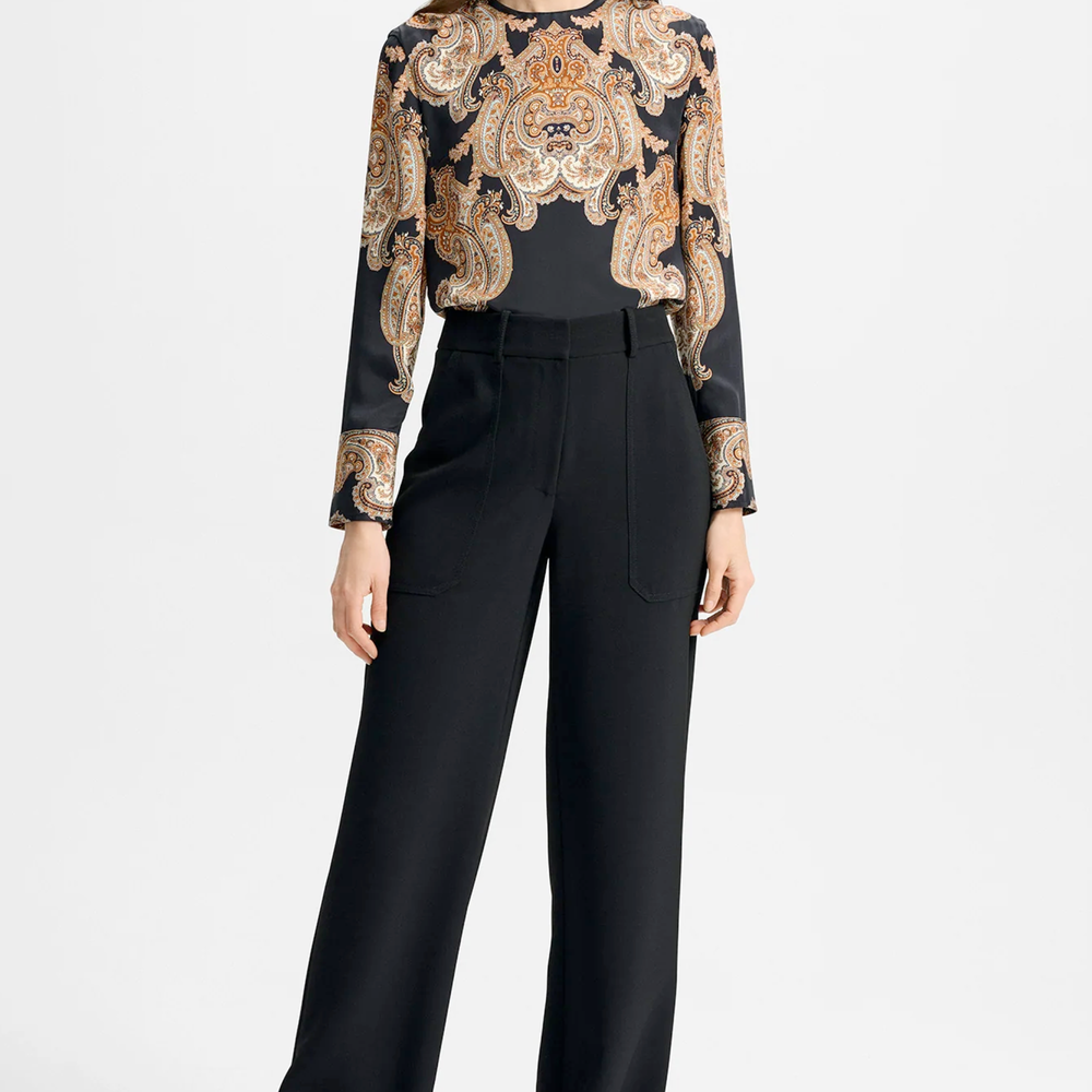 Model wearing black Veronica Beard pants.