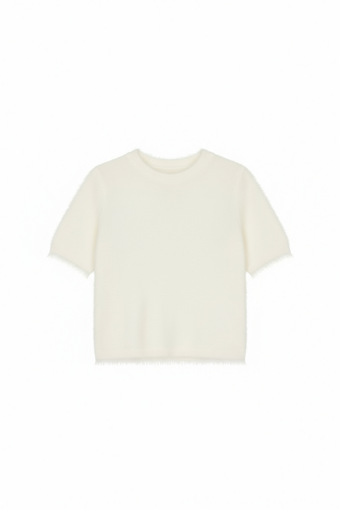 A model wearing a fuzzy feather knit white sweater with a crew neckline and sort sleeves.