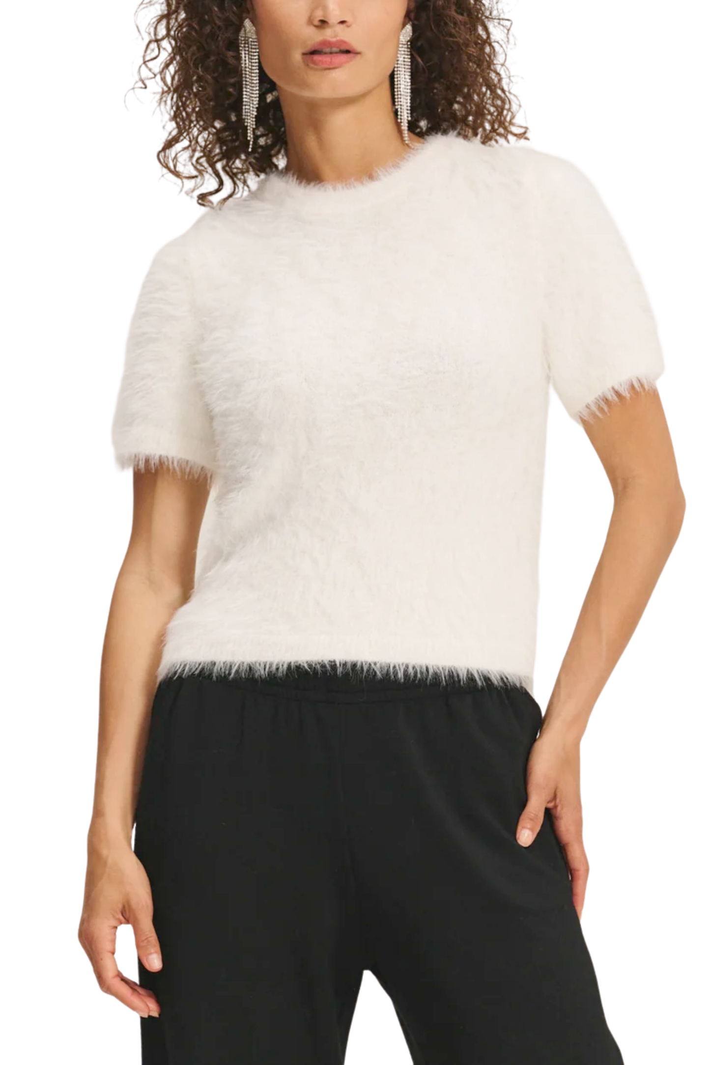 A model wearing a feather yarn knit white sweater.