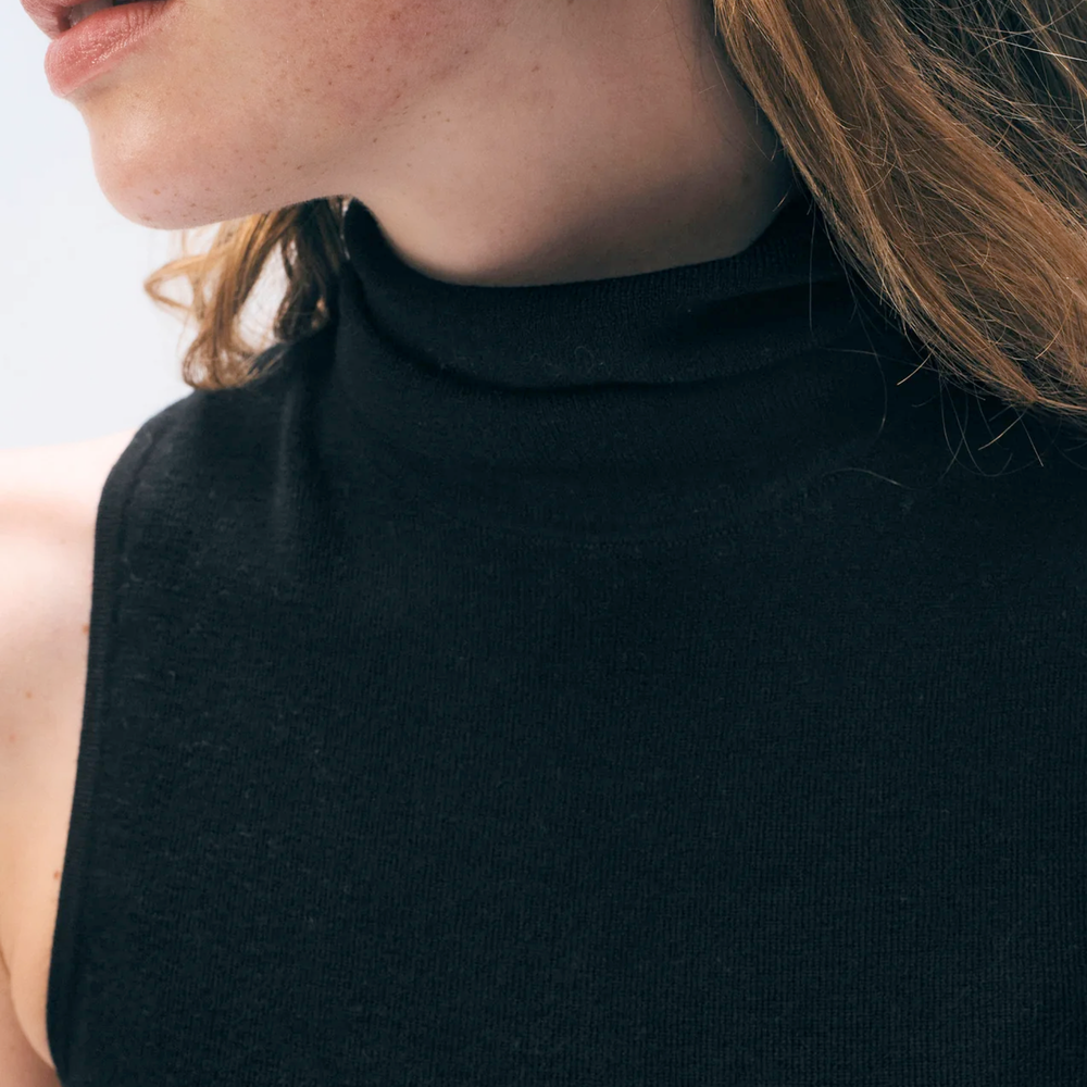 
                  
                    Model wearing a sleeveless black turtleneck from White & Warren
                  
                